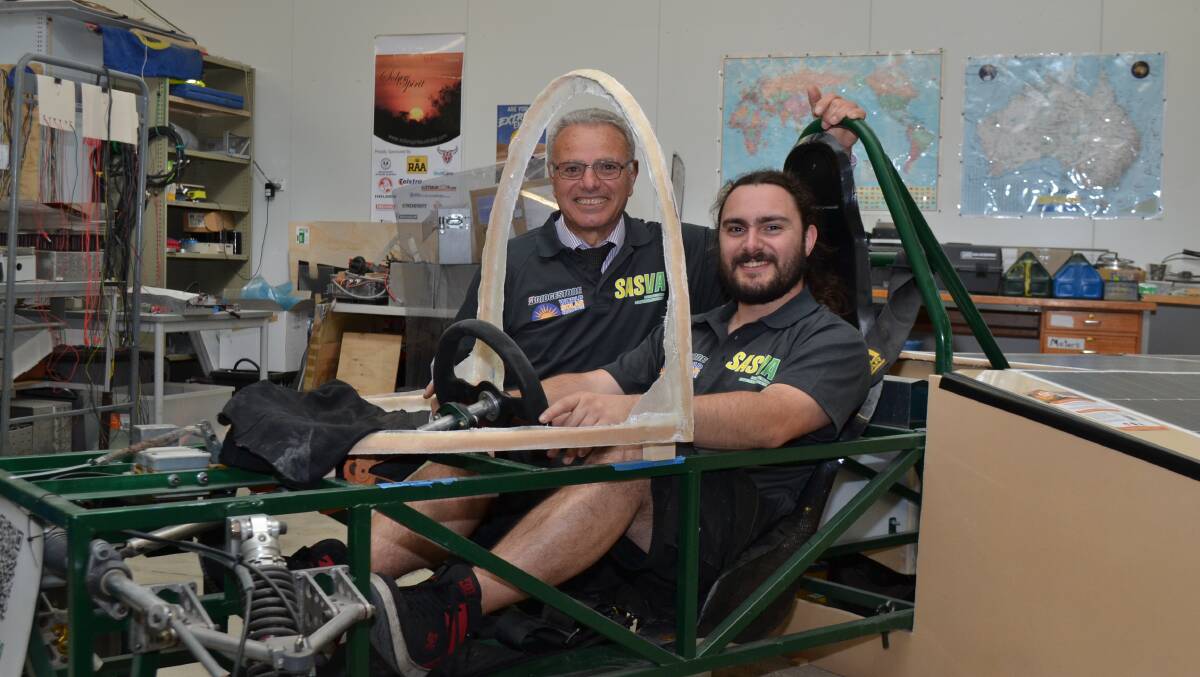 Pat Bosco and William Farina with Sun Sprite, the South Australian Solar Vehicle Association's entry to the Bridgestone World Solar Challenge 2023. Picture by Anthony Caggiano