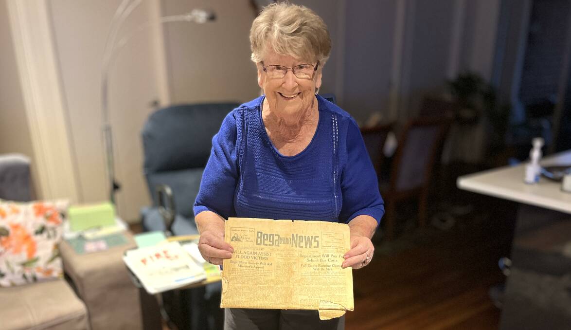 Shirley Dawson with one of a handful of vintage Bega District News and Bega Times newspapers which she and her mother Myrtle had saved for upwards of 70 years. Picture by James Parker