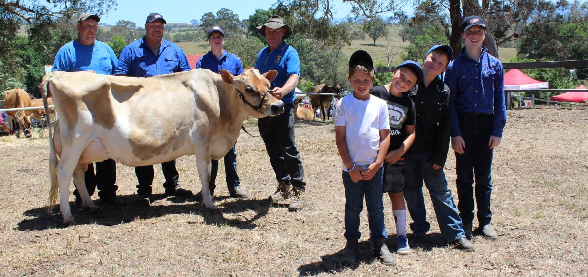 CHAMPIONS: Robert Salway, with sons Aaron and Tim and grandsons Ryan, Jack, Colt, Blake and Dylan of Cobargo, with supreme champion cow 'Wilgo Benie Delight'. 