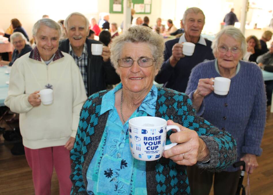 CUPPA FOR A CAUSE: Organiser Lena Pearce (front) with long-time volunteers Val and Keith Evans, Len Crowe and Isabel Bobin. Picture: Liz Tickner