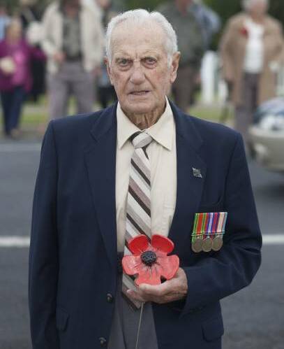 LEST WE FORGET: Bill Allen, who passed away on April 24, 2017, was presented with a ceramic poppy at the Bemboka Anzac Day ceremony in 2015. He is remembered as a devoted family man, hard worker and keen sportsman. 