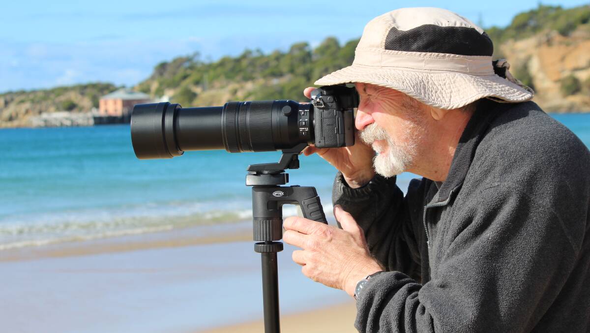 WHALE WATCHING: Dave Gallan keeps a close eye on a pair of whales spotted off Tathra Beach on Friday.