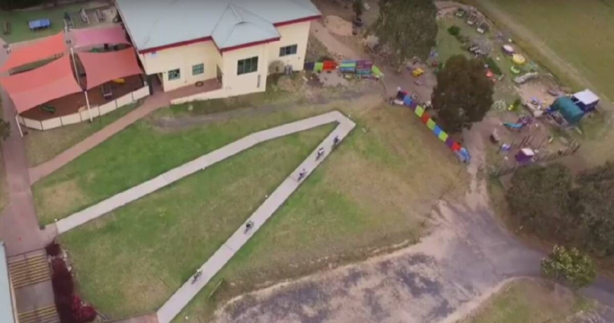 Screen grab of cyclists racing around the Sapphire Coast Anglican College during the weekend event.
