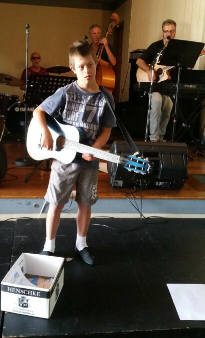 STAR: Air guitarist Lochie Neilson at the Bermagui Country Club's recent celebration of people with disability. 