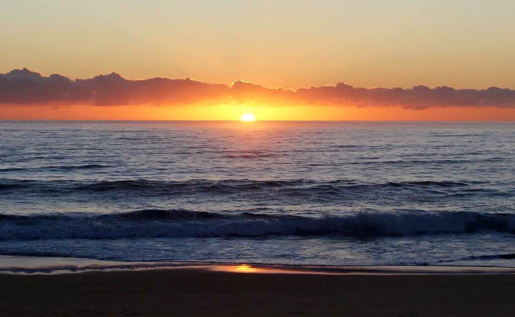 BRIGHT NEW DAY: Monday's stunning sunrise at Gillards Beach, near Tathra, as submitted by Janet Maybury.