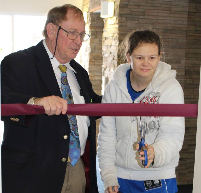 ON SCREEN: Jacinta Robinson cuts the ribbon on Tulgeen's new INSYNC centre in Merimbula last month. Jacinta is one of many Tulgeen participants involved in a new short film.