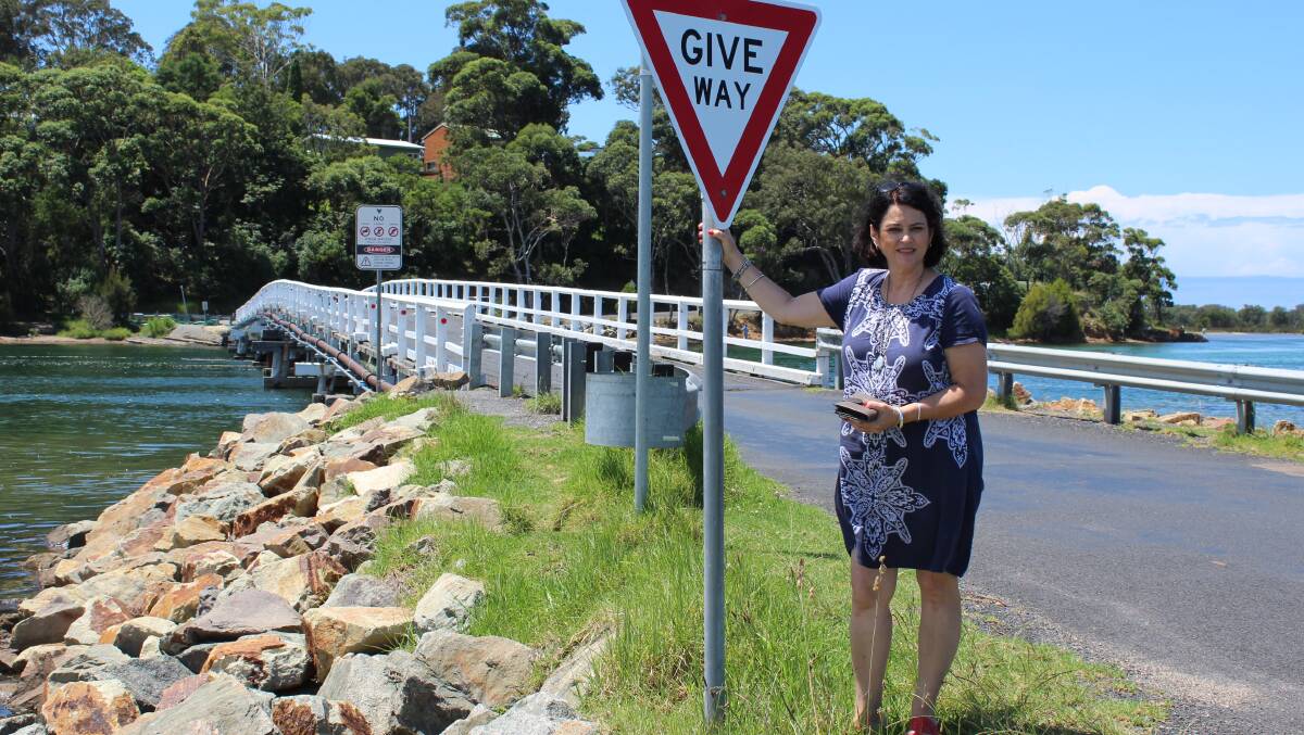 RIGHT OF WAY: Michelle Frost of Regatta Point says she is frustrated with motorists ignoring the give way sign at the Wallaga Lake Bridge.