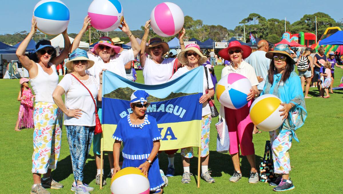 Bermagui CWA ladies get into the mood for the parade at the Bermagui Seaside Fair, singing 'Oh, I do like to live beside the seaside' while marching the main street.