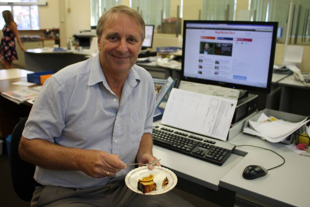 Bob in his usual spot at the production computer - this time with cake!