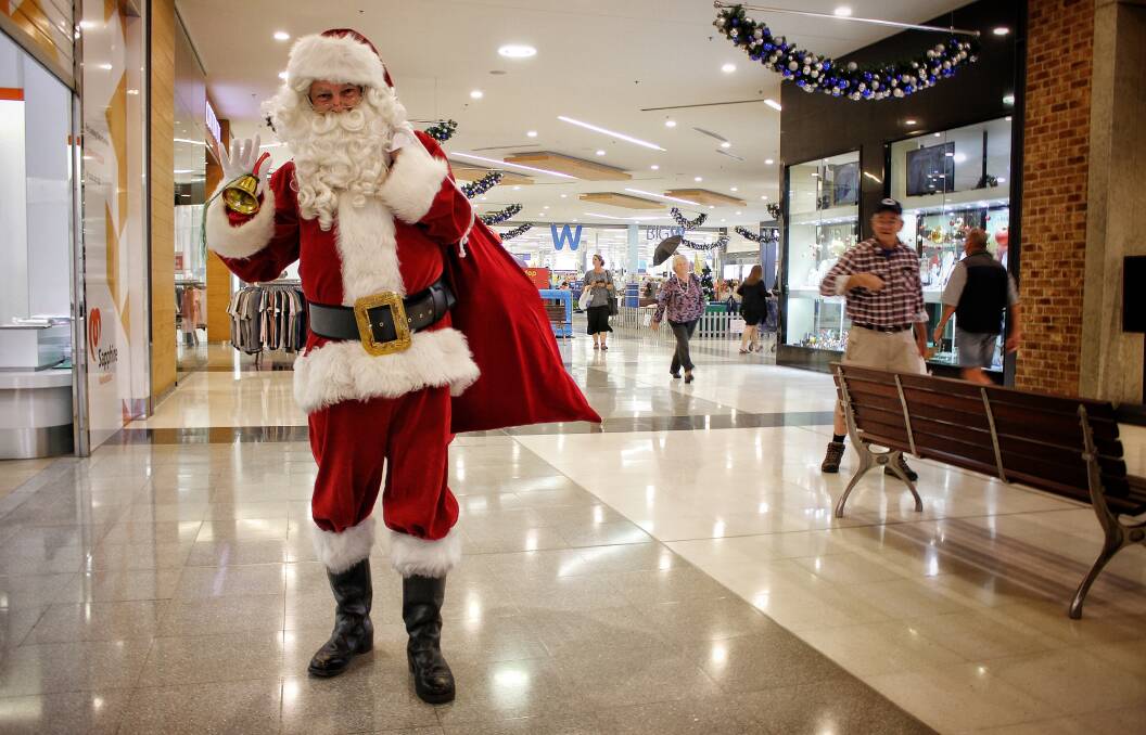 JOLLY MAN IN RED: Santa visits the Sapphire Marketplace in Bega bringing joy - and photo opportunities - to shoppers this Christmas.