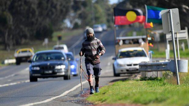 Clinton Pryor is walking from Perth to Canberra and is traveling through the Bega Valley this week. Photo: Joe Armao