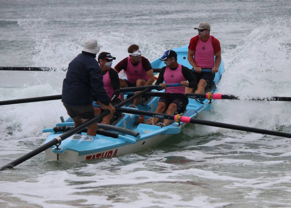LAUNCH: Tathra rowers - in their surfboat "Curly Annabel" - set out on day five of the George Bass Surfboat Marathon. Picture: Jacob McMaster.