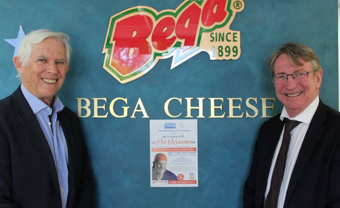 Gary Potts and Barry Irvin celebrate Bega Cheese's fifth year of supporting the Mumbulla Foundation's annual gala dinner. 