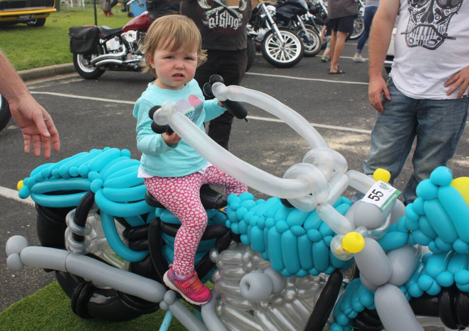 Rod Taylor's "air-powered" custom motorbike was a hit at the Bermagui Bike Show, including for young Annabelle Power. Watch the video at begadistrictnews.com.au