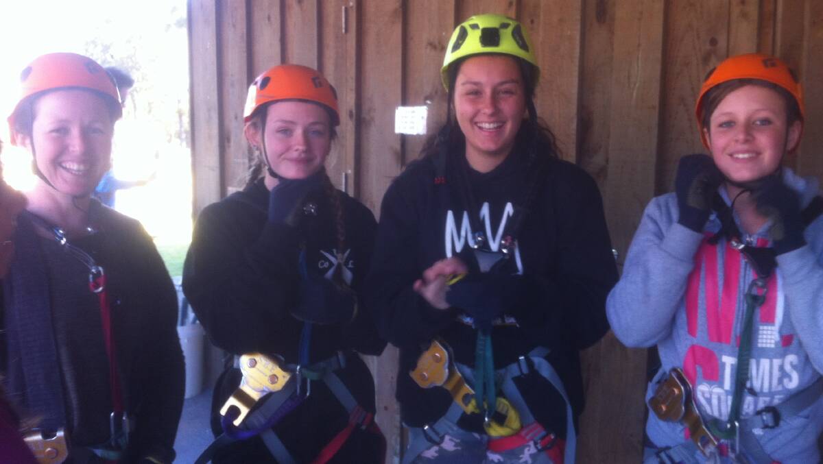 Dalice Partridge, Eliza, (from Cobargo)  Keeley Burden (Bega) and Bethany Partridge (from Cobargo) prepare to do the tree climb at Magic Mountain in the school holidays.