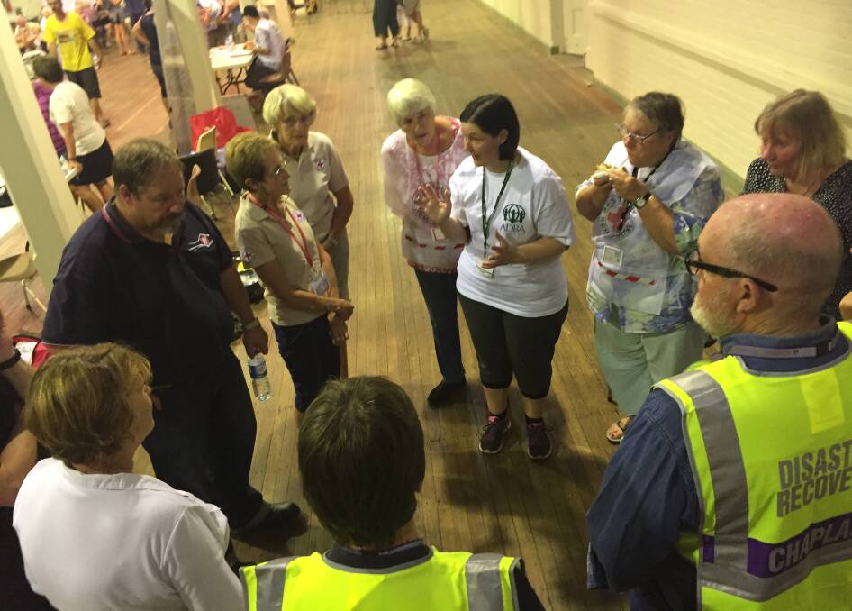 Kylie Cullinan from ADRA coordinates relief agencies at the Bega evacuation centre on Sunday night. Photo: Ben Smyth