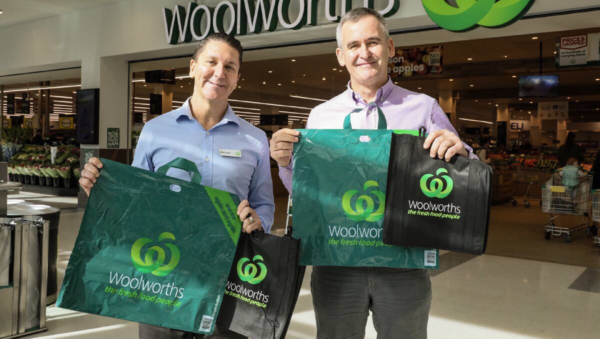 Woolworths Stores director Michael James and Woolworths Group CEO Brad Banducciwith the range of new thicker reusable plastic bags that are to replace single-use plastic bags.