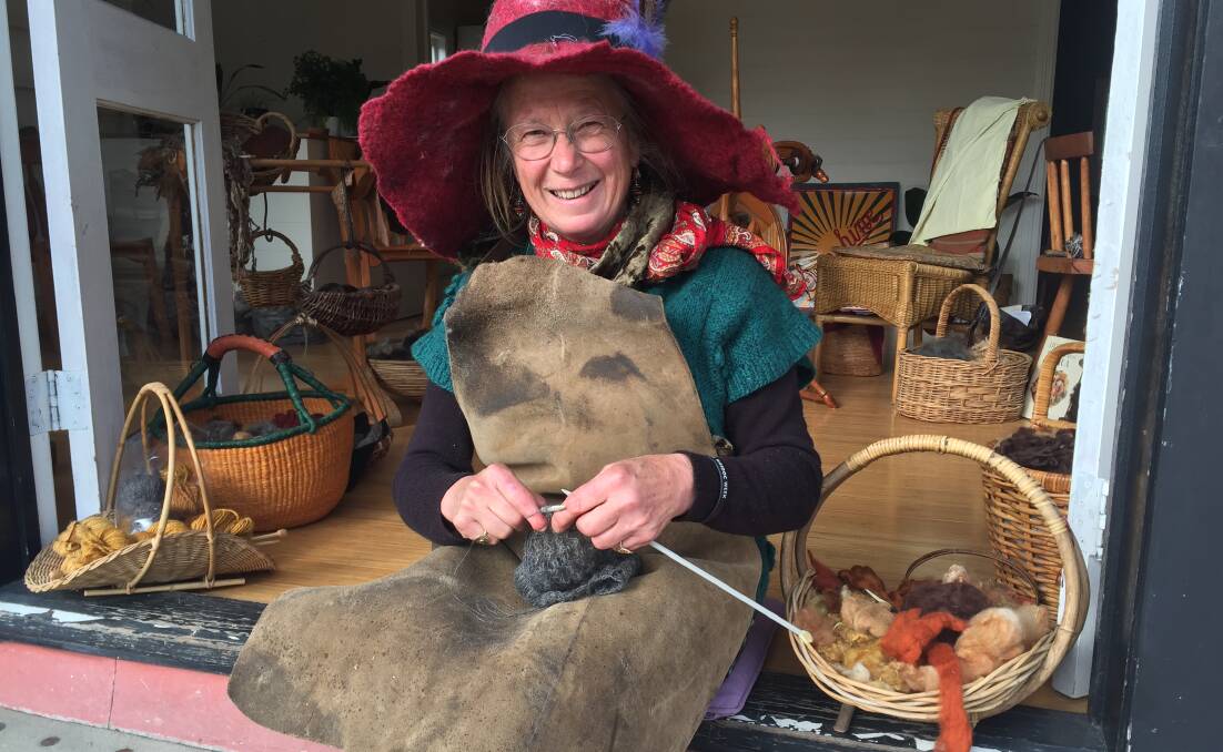 ARTISAN: Margaret Goddard crafts a pretty picture as she knits with fine alpaca wool during Cobargo's Saturday street market.