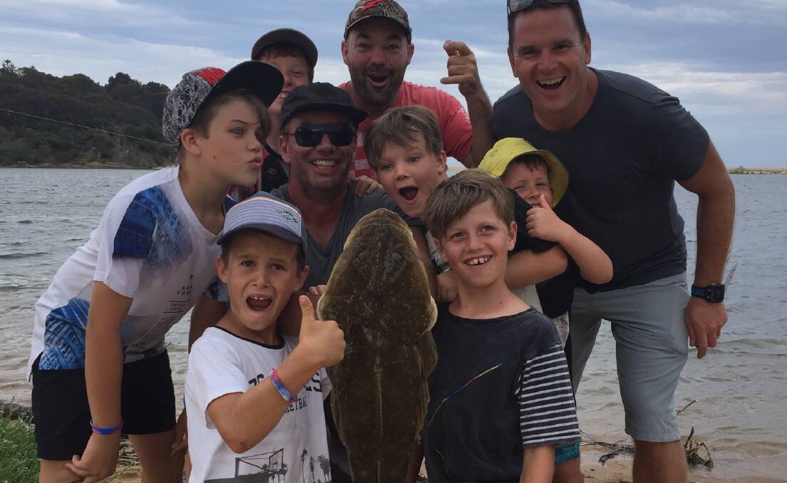 BIG CATCH: While on a family holiday at Tathra Beachside, Damien March pulled in this 11pound flathead from the Bega River mouthusing pilchard bait on a 10lb line.