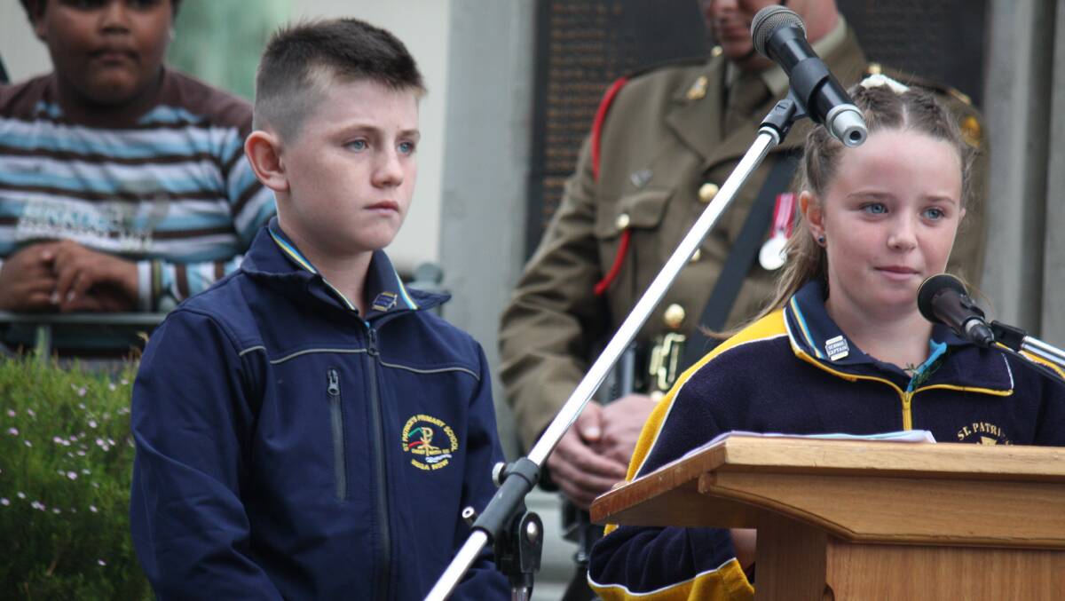 LEADERSHIP: St Pat's pupils Zoe Grant and Sam Griffin give the oration at Bega's Anzac Day service