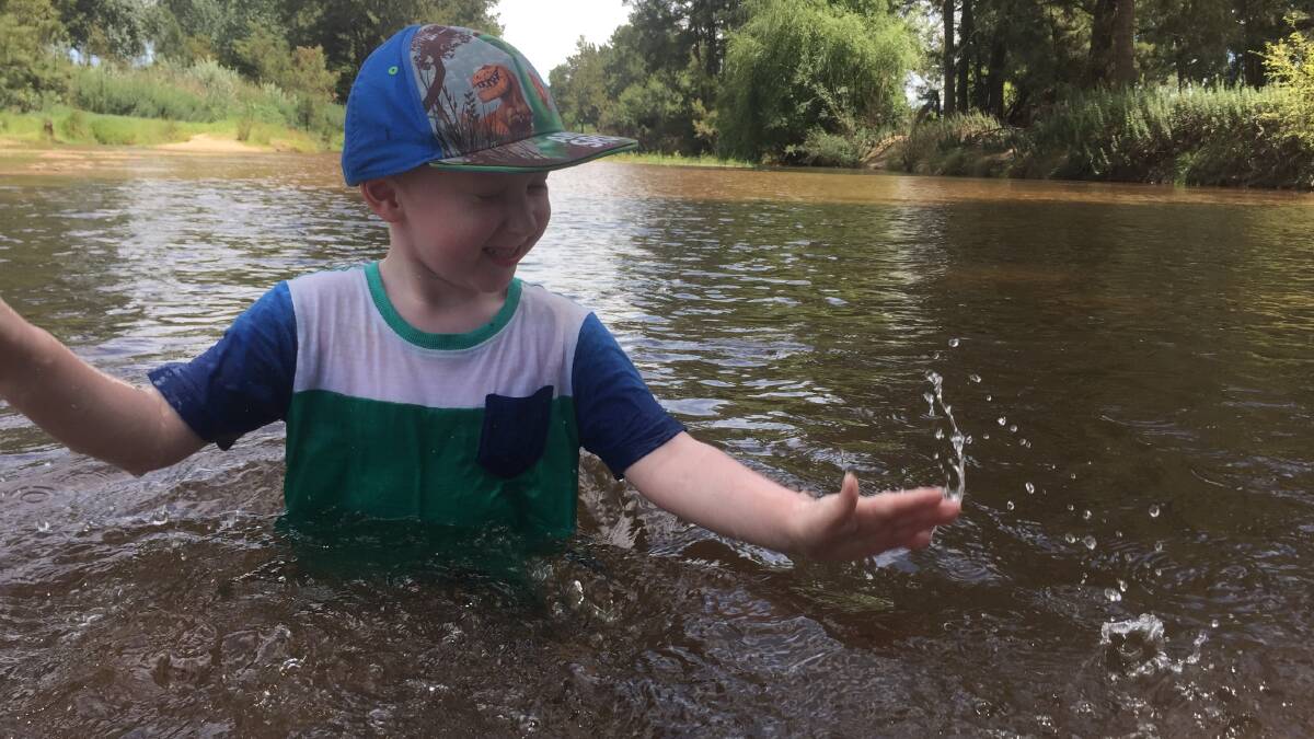 Dane Gordon, 5, of Wyndham, cools off at the Bega River Junction as the mercury begins to rise across the state. Picture: Albert McKnight