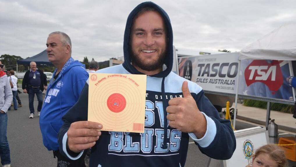BULLSEYE: Gene Willis of Narooma shows off his impressive air rifle target shooting result during Narooma HuntFest on the weekend.