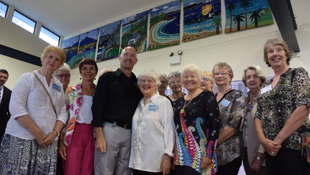 Dawn Hollins and the Bermagui U3A Rug Hookers with their seven rug panels to be hung in the Bermagui Surf Club. 