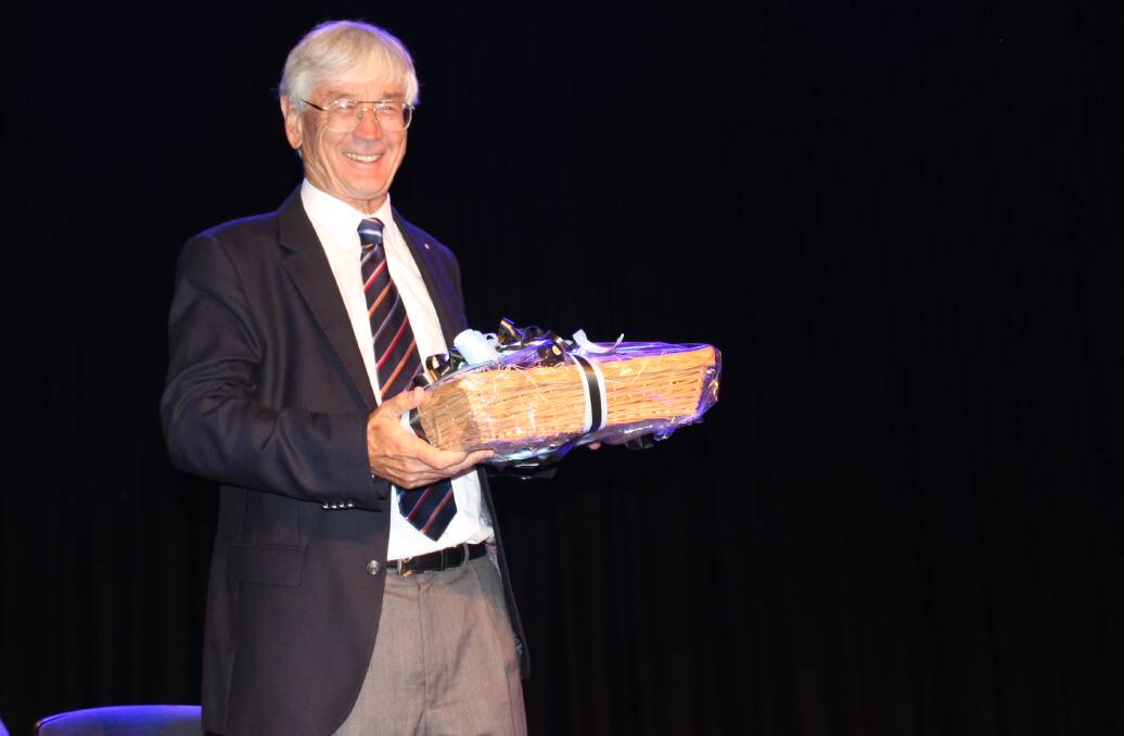 Dick Smith is presented with a gift hamper as Australia Day Ambassador for the Bega Valley