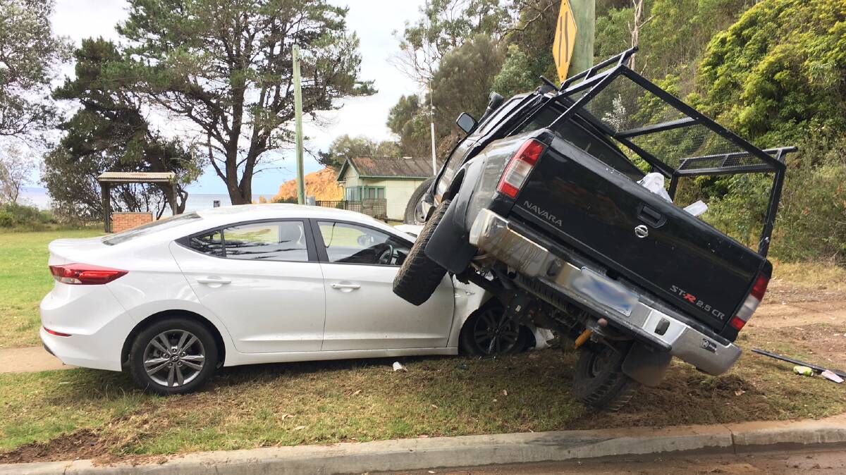 A car crash at Tathra late Monday saw the driver of a Nissan ute hospitalised and power cut to the town, while the elderly couple in the white sedan escaped unharmed.