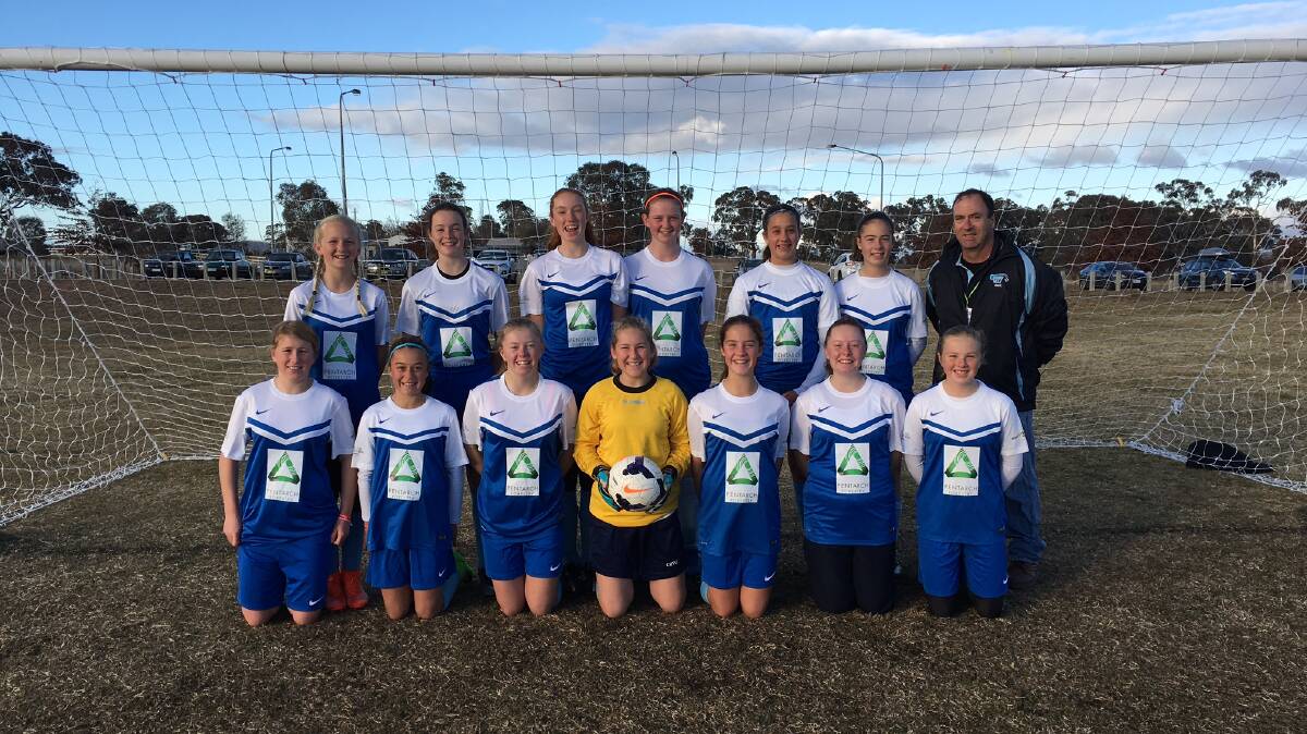 COMPETITIVE: Far South Coast Soccer Association U14 Girls squad members with coach Paul Webster during their strong performance at this year's Kanga Cup.
