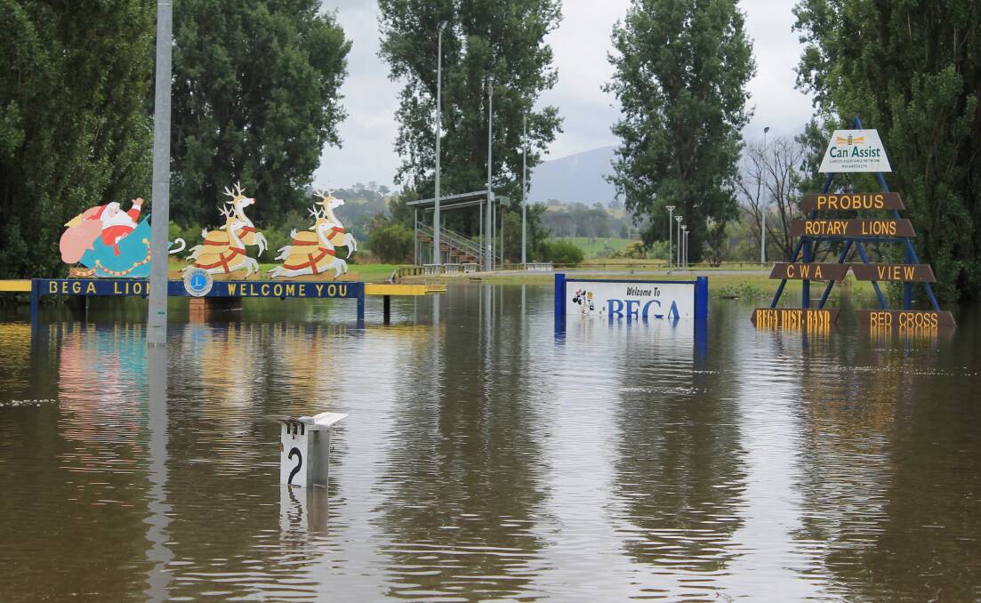 WELCOME TO BEGA: The two-metre flood indicator peeks above the water as Santa and his reindeer enjoy high ground on the Bega Lions Club picnic shelter,  January 6.