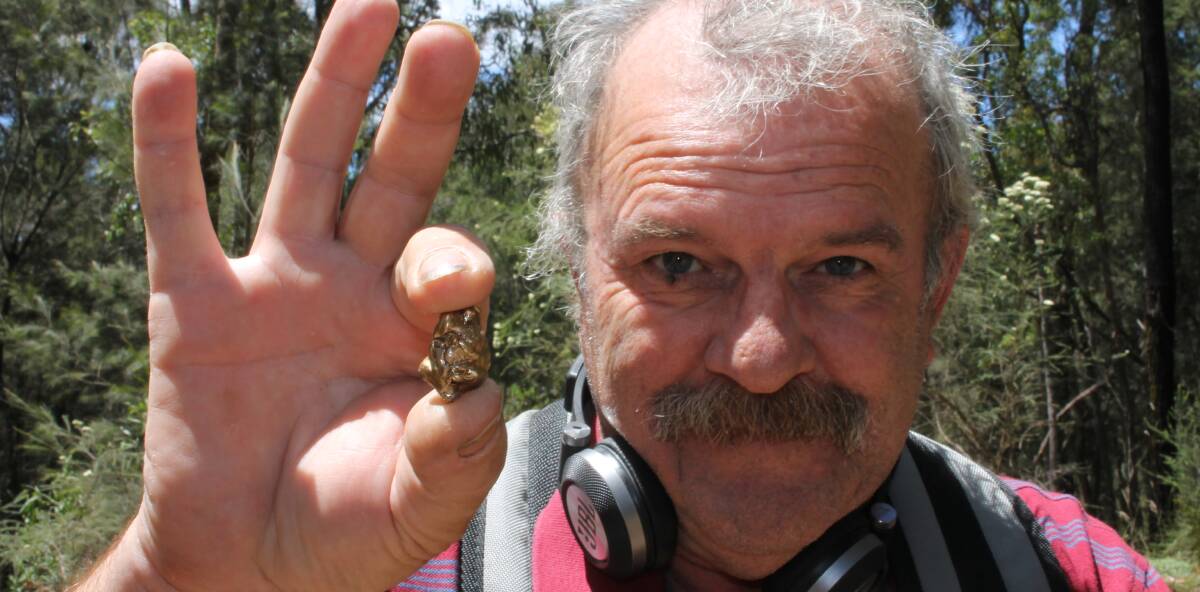 EUREKA!: Tathra's Doug Spindler, holding a piece of pretend gold, is encouraging people to take up the outdoor hobby of fossicking. 