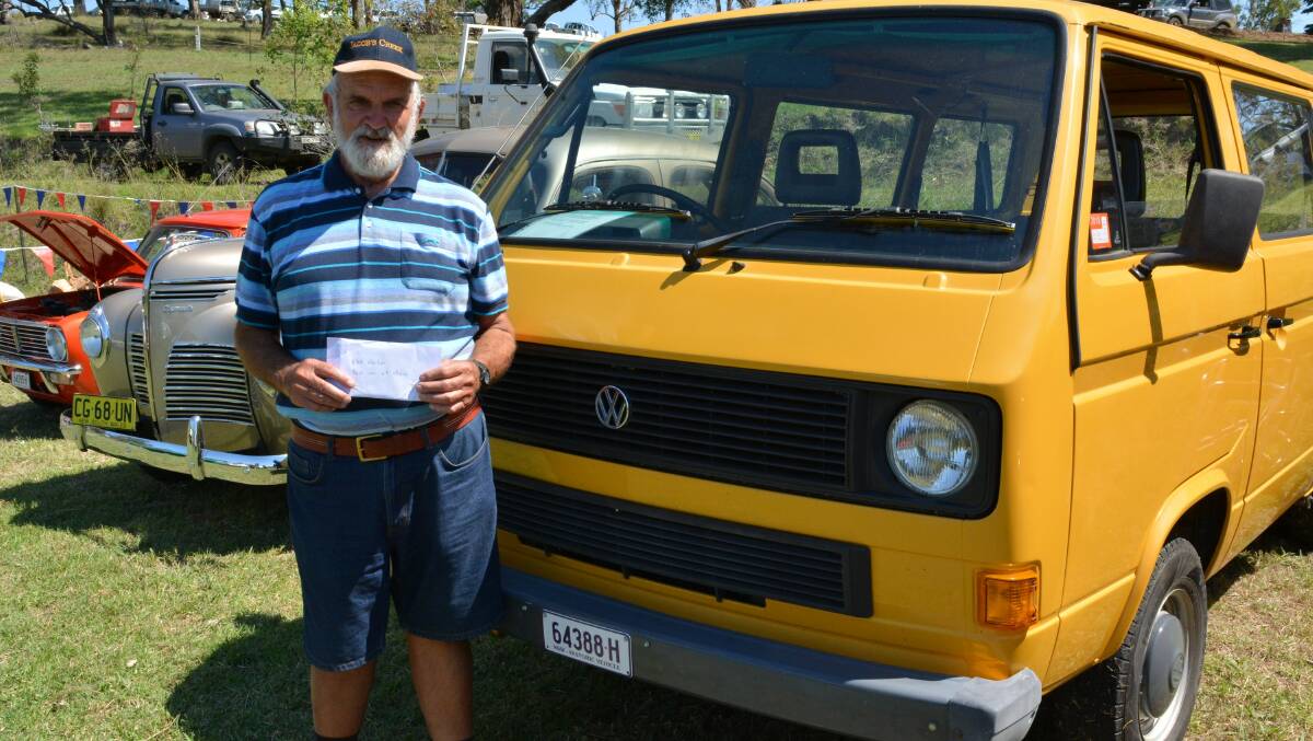 KOOL KOMBI: Chris Steel collects a $50 Betta voucher supplied by the Bega District News as the winner of best historic vehicle at the Bemboka Show.
