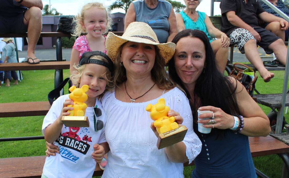 WINNING SMILES: Carmen Risby (centre) from Tathra Beachside 'bought' the winning pig in the first two race calcuttas on Sunday, winning more than $800 in the process.