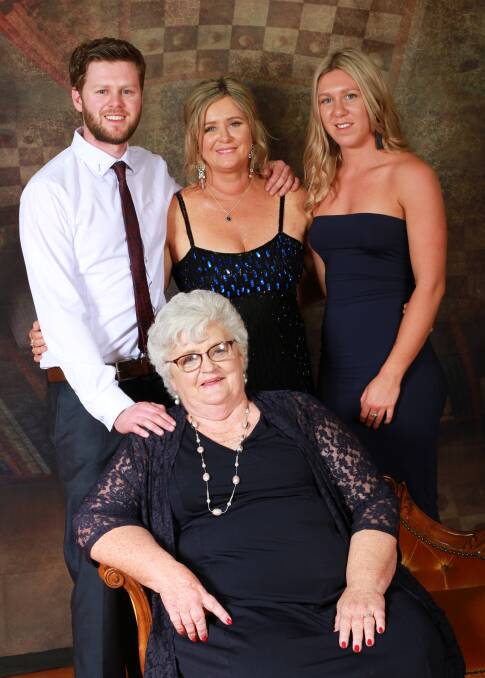 One last bash: Jan Watling attends her last Bega debutante ball as event coordinator with Clark, Kylie and Madi D'Arcy.  Photo: Angi High Photography