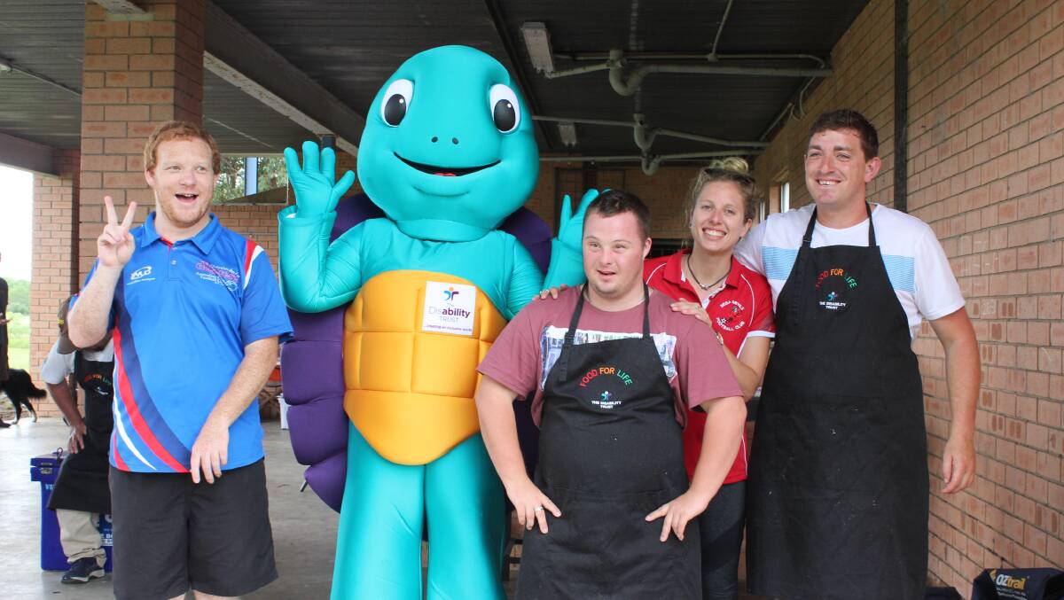 Trusty the turtle makes a surprise visit to the Heart Foundation walkathon and stops for a quick picture with Paul Zeller, Andrew Onnen, Nicole Constable and Callum Haydon. 