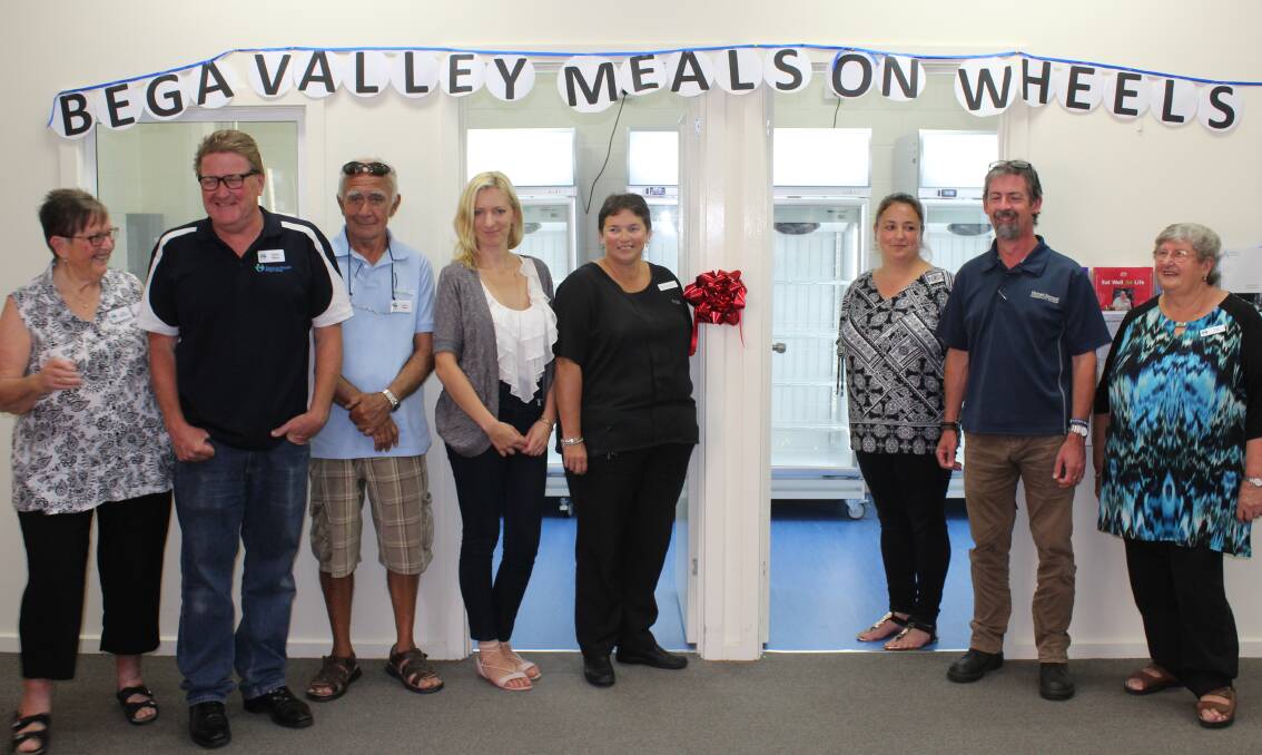 Bega Valley Meals on Wheels volunteers officially open their new storage room complete with four new food freezers alongside community supporters.