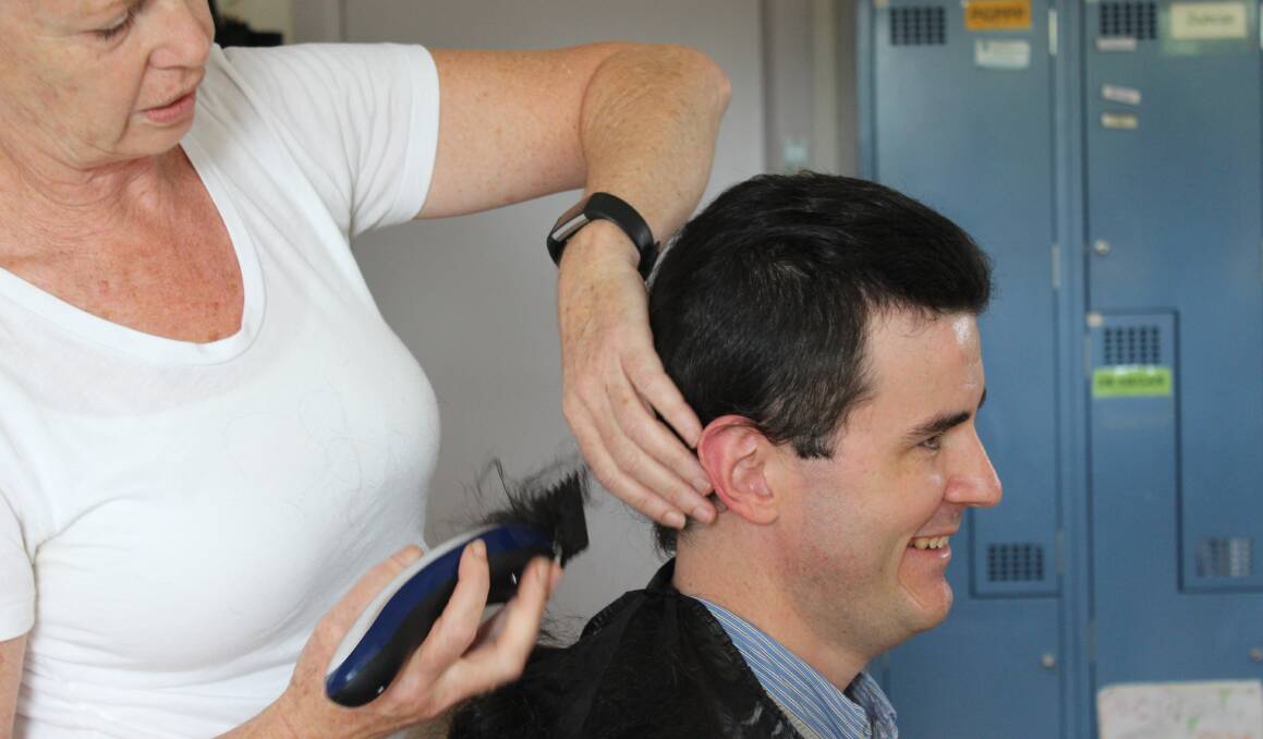 CUT FOR A CAUSE: Bega Valley Medical Practice psychologist Monica Blayney shaves Dr Konrad Raerdon's head for the Leukemia Foundation's  World's Greatest Shave.