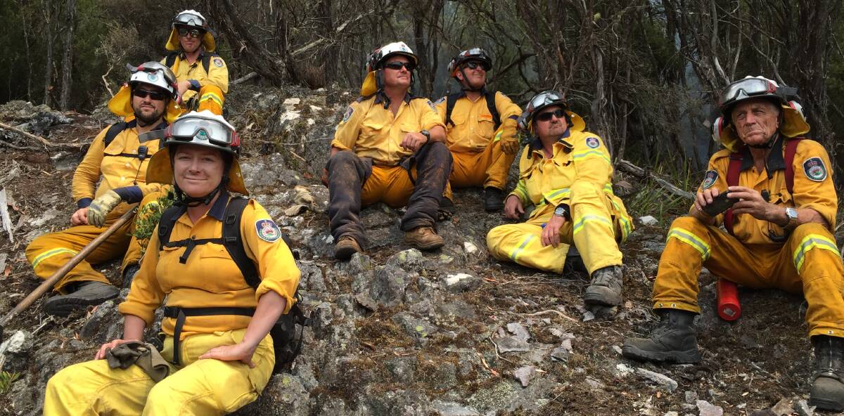 Australia Day: The local remote area specialist team awaits water bombing on a very active part of the fire that was threatening crew safety. 