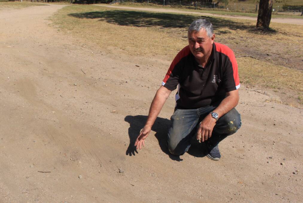 David Warren points to some of the problem areas on the road into the Wolumla recreation ground and Pony Club.