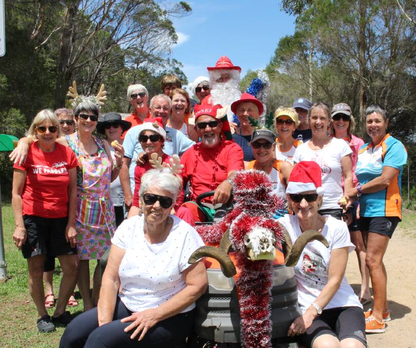 Christmas fun: Merimbula Water Dragons celebrated Christmas with a barbecue at Top Lake after taking the dragon boat out for a paddle on Saturday morning.