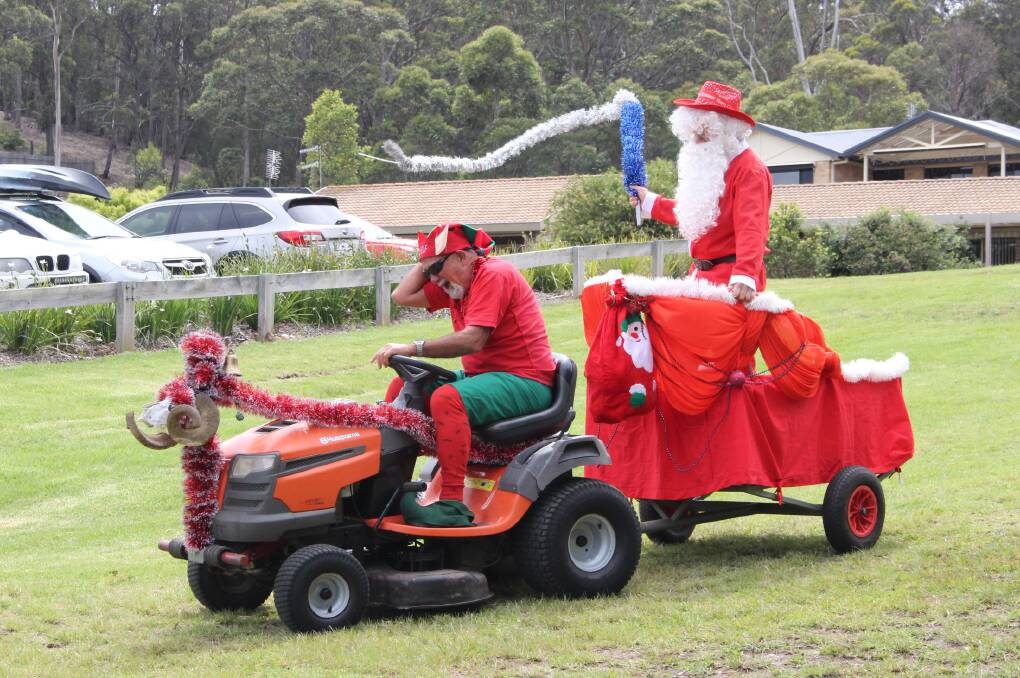 Santa was cracking whip as he came hurling down the slope at Top Lake to visit the dragon boaters.