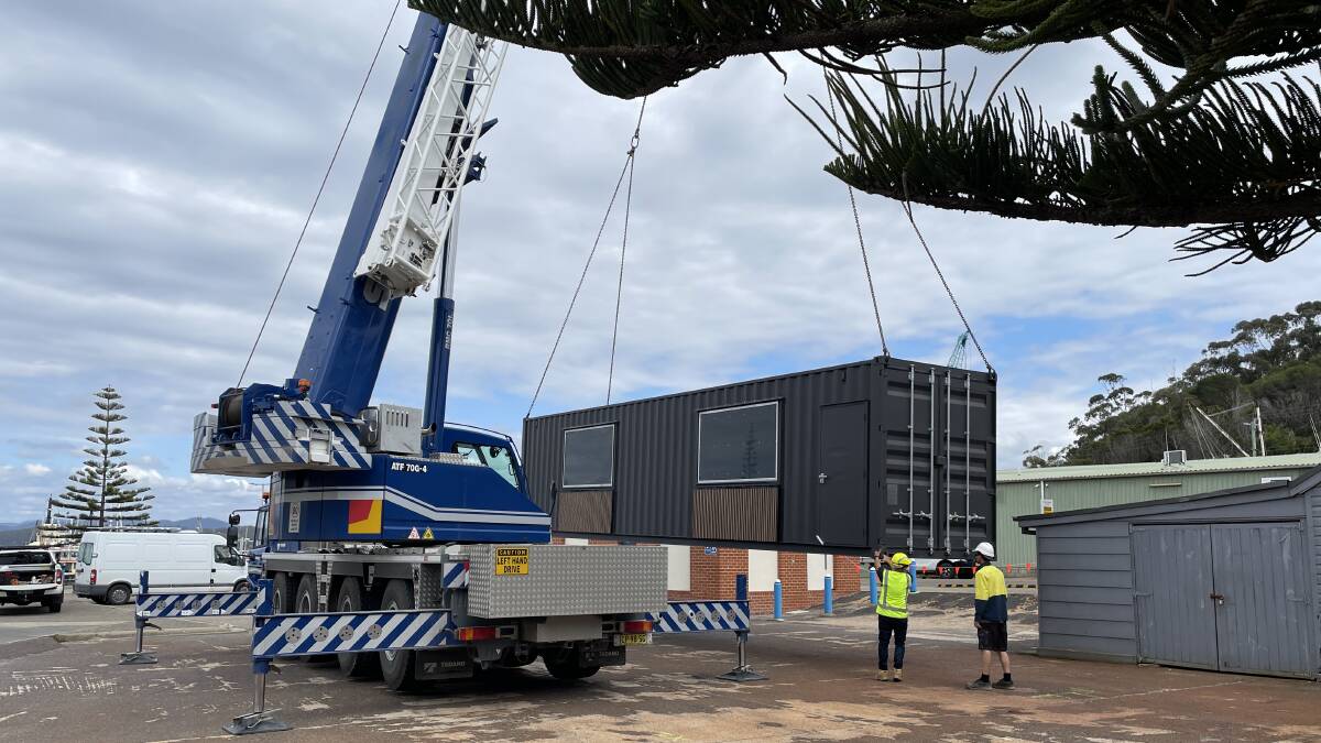 The first of the containers getting placed. Picture by Denise Dion
