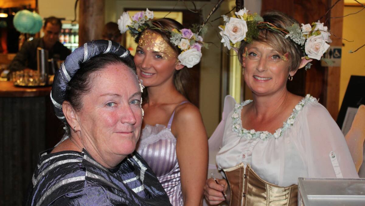 Last year's Mumbulla Foundation Gala Dinner had a Midsummer Night's Dream theme. At it, Cynthia Law has her face painted by Joy Clarke with daughter Bonnie (centre) helping.