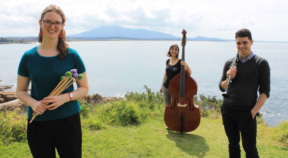 READY TO PERFORM: Thea Rossen, Kinga Janiszewski and Luke Carbon of the Paper Plane Trio stop in at Bermagui while on their visit to the area.