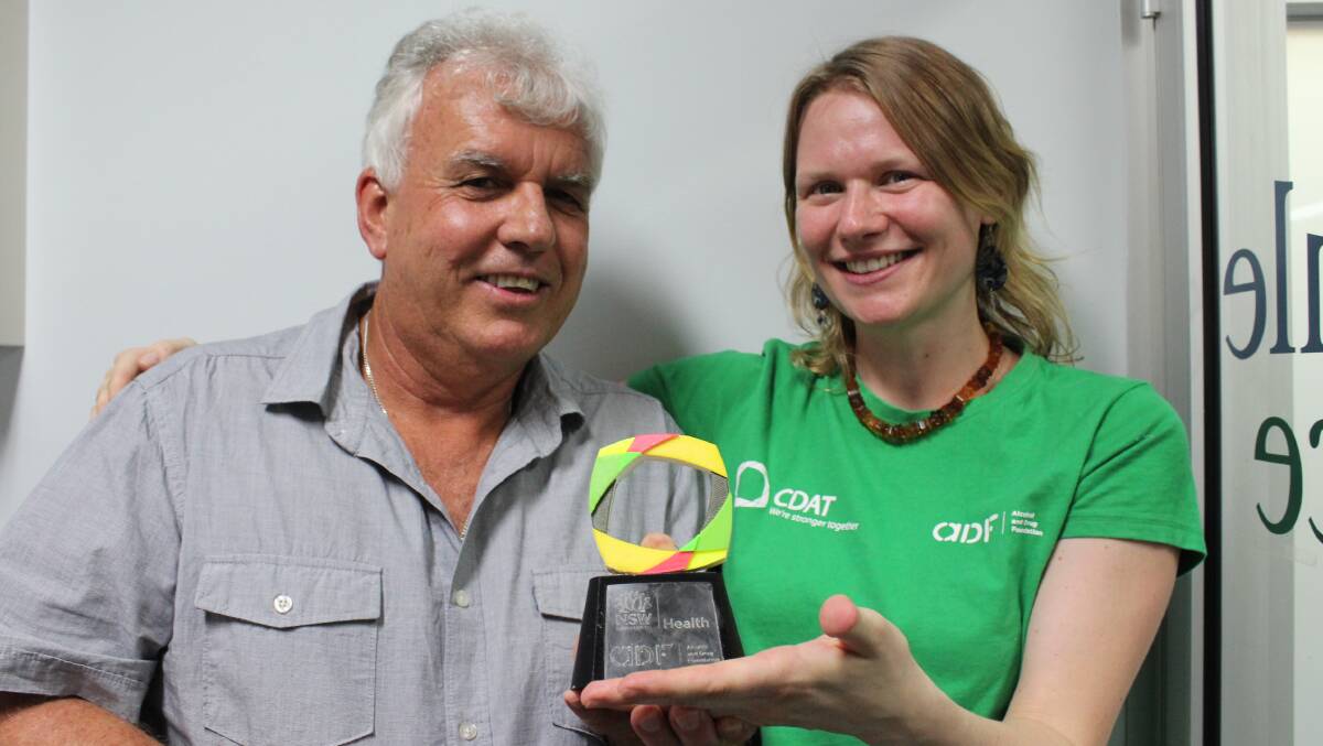 WELL DESERVED: Alcohol and Drug Foundation senior community development officer Amy Ehsman presents the award to Bega Valley CDAT chair Paul Brunton last week. 