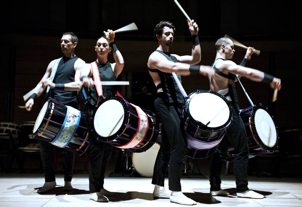 BANG THE DRUM: Tom Royce-Hampton (second from right) performs as part of Taikoz, who are are one of the acts scheduled for the Four Winds Festival this year. Photo: Karen Steains