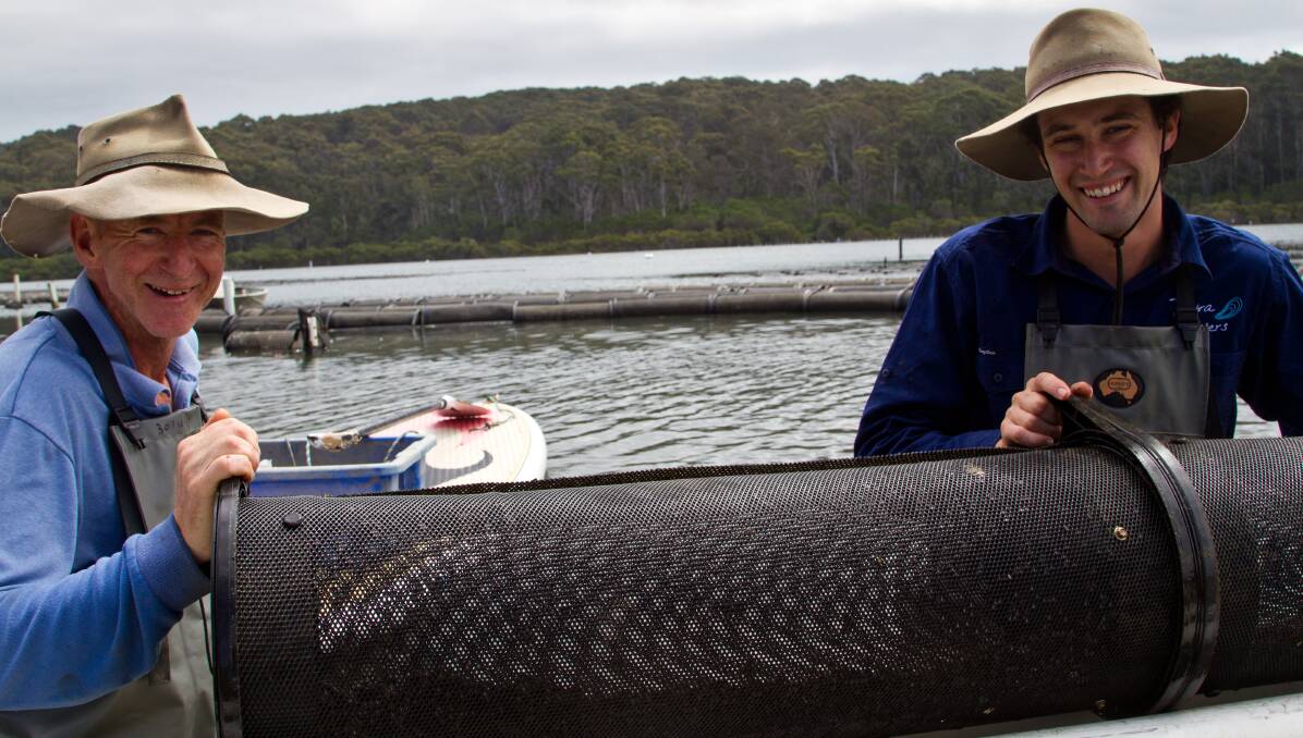 GROWING SUCCESS: Tathra Oysters owner Gary Rodely with his son Sam, the oyster farm's manager. 