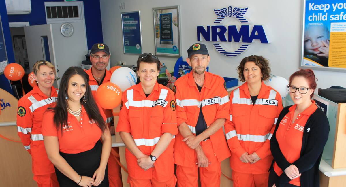 UNIFORM: Dressing in the same colour for Wear Orange Wednesday are members from the SES and NRMA Kelley Gould, Sharleen Hijazi, Rod Gould, Cass Whyman, Bill Fletcher, Yvette Ringland and Maddi Richardson. 