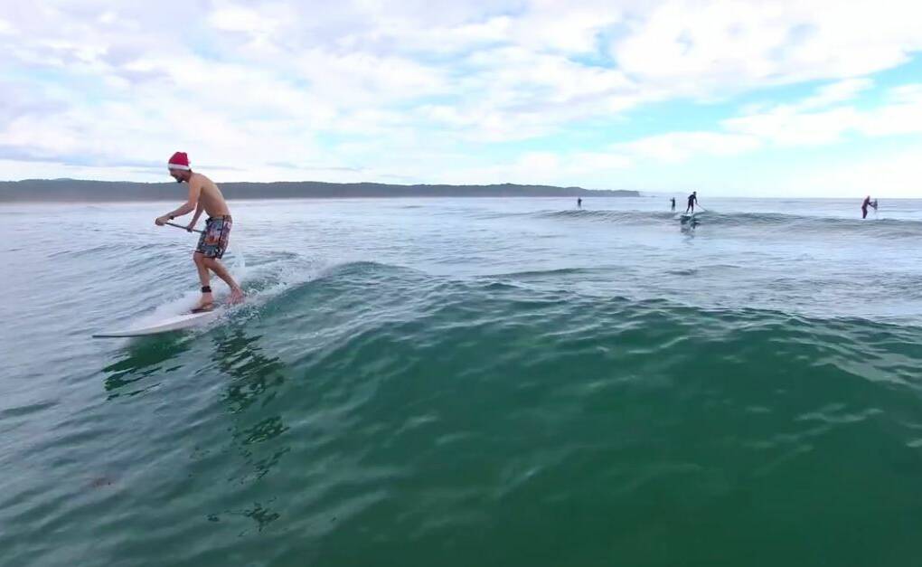 SURF'S UP: Mitch Alker shared fantastic drone footage of a Christmas-themed stand-up paddleboard session at Tathra Beach on the Bega District News' Facebook page. 